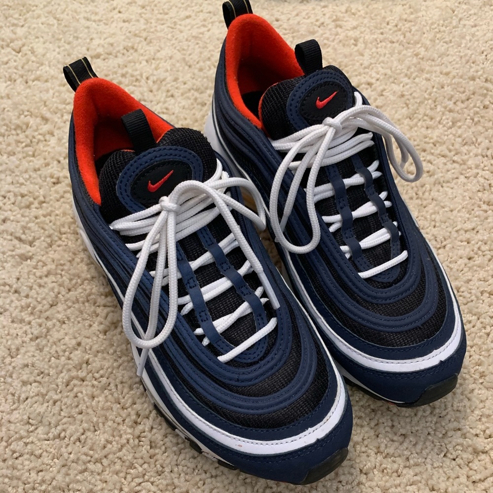 Nike shoes in the red white and blue.